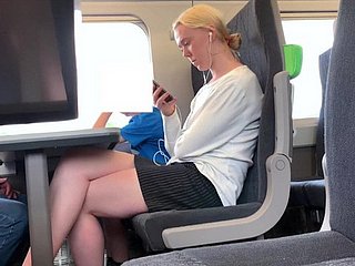 Blonde with beautiful legs on the train